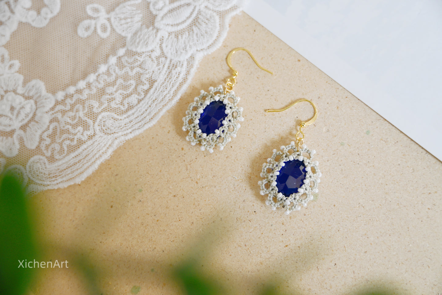 tatting earring with blue crystal