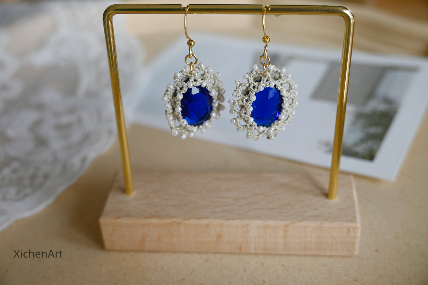 tatting earring with blue crystal