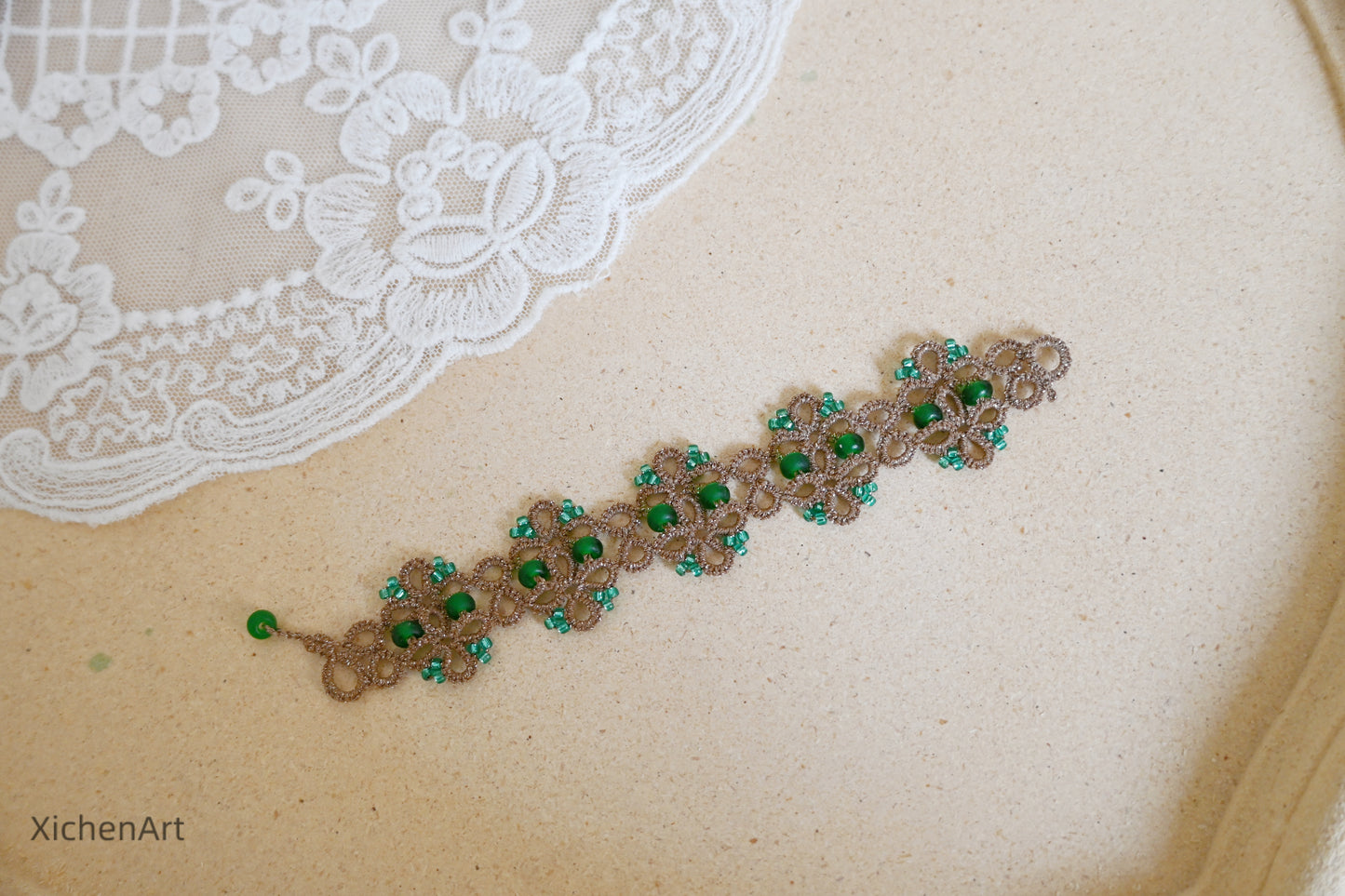 Tatting lace bracelet with metallic thread and glass beadsTatting lace bracelet with metallic thread and glass beads