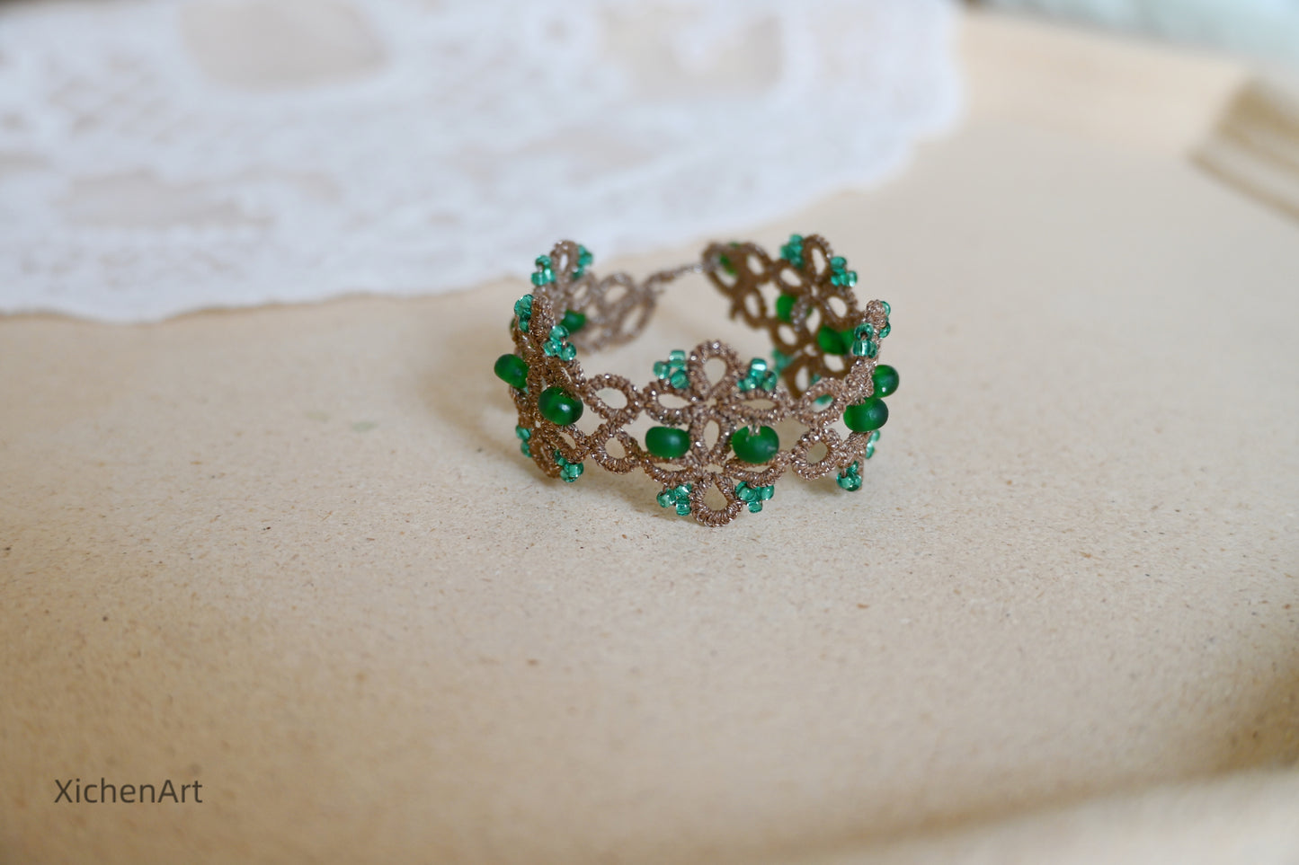 Tatting lace bracelet with metallic thread and glass beads