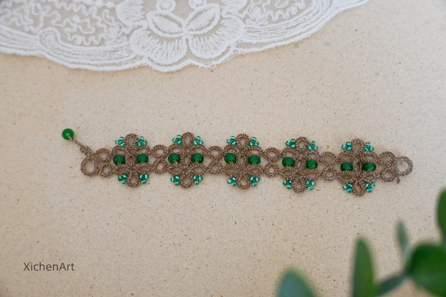 Tatting lace bracelet with metallic thread and glass beads