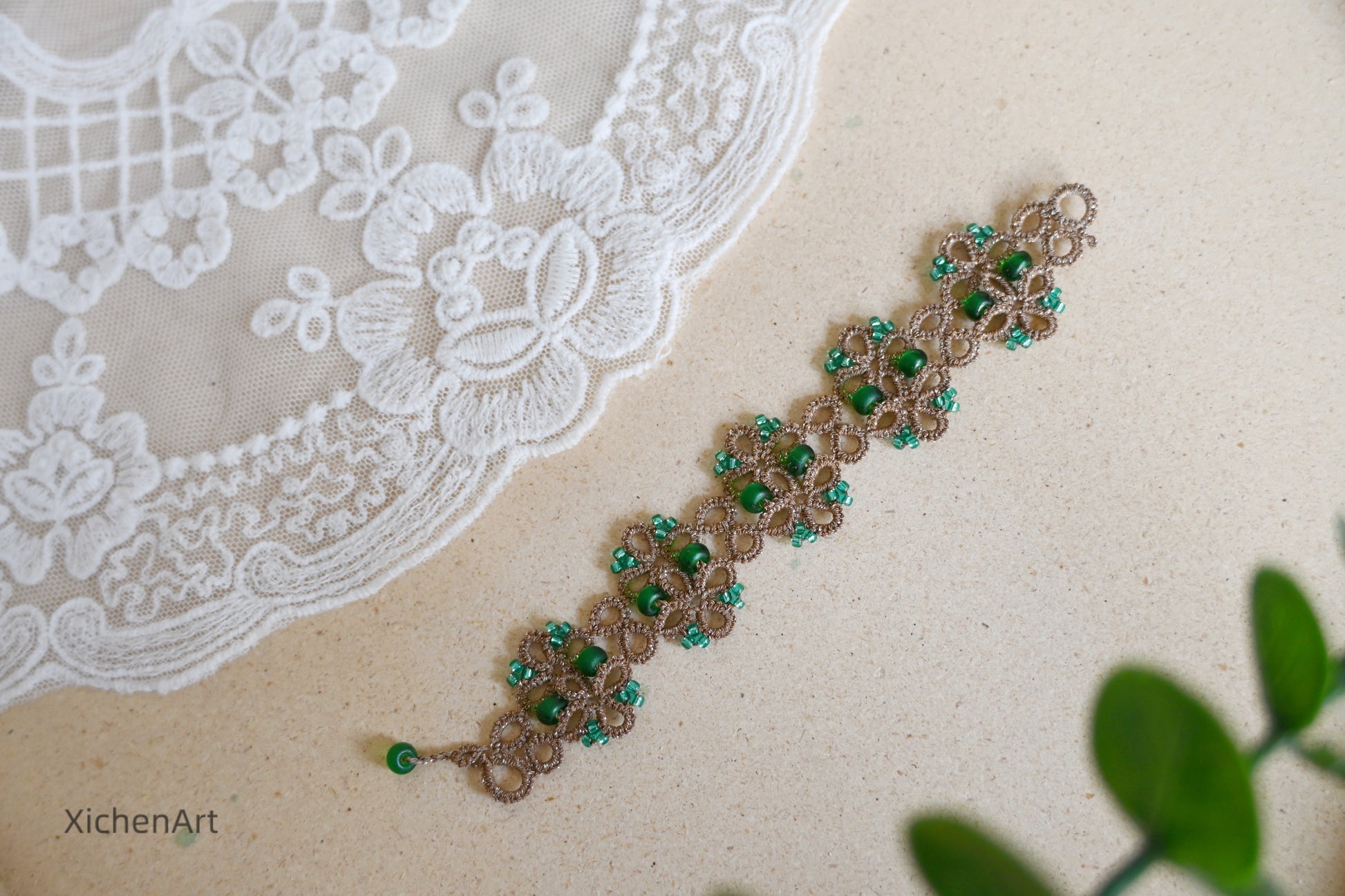 Tatting lace bracelet with metallic thread and glass beads