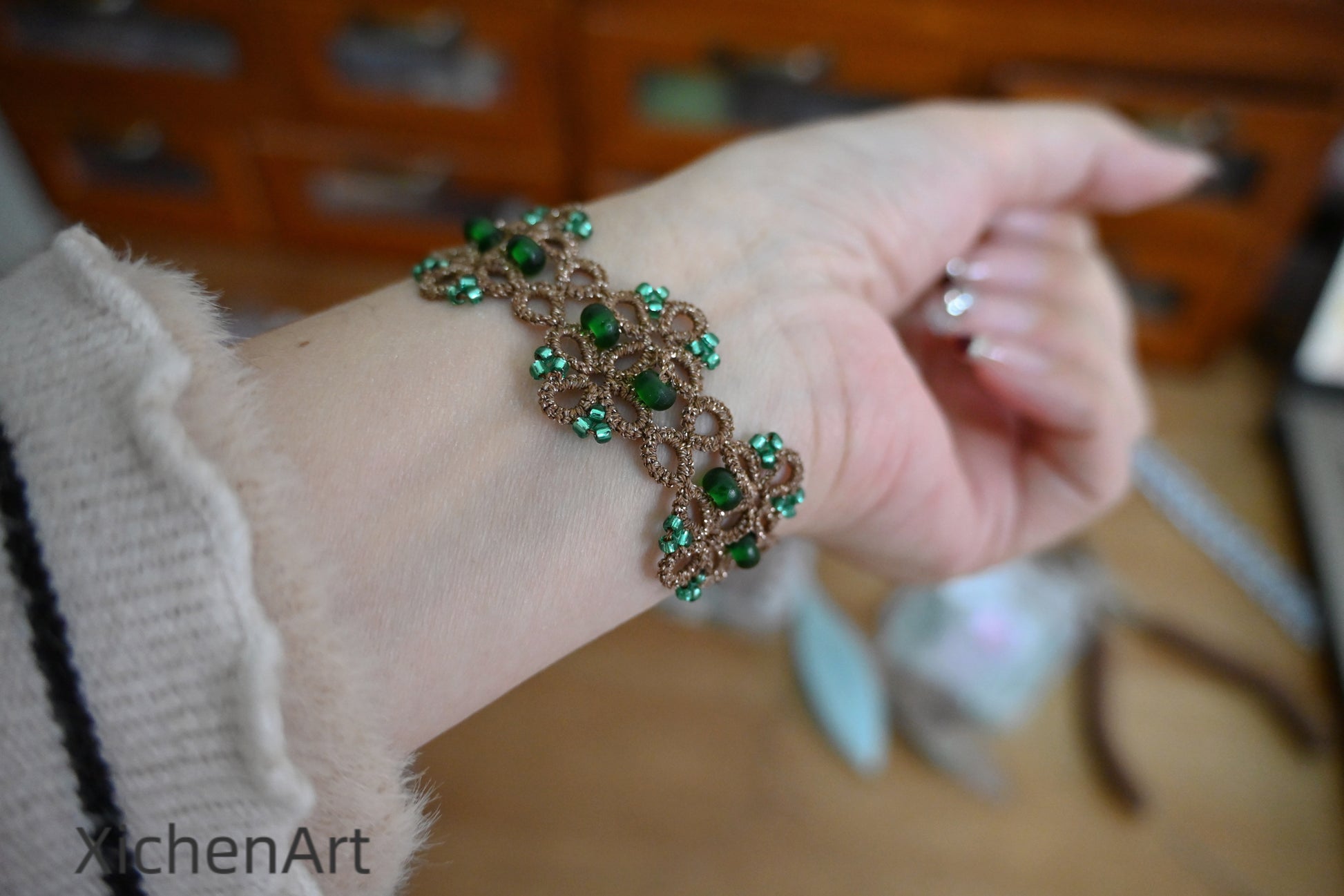 Tatting lace bracelet with metallic thread and glass beads