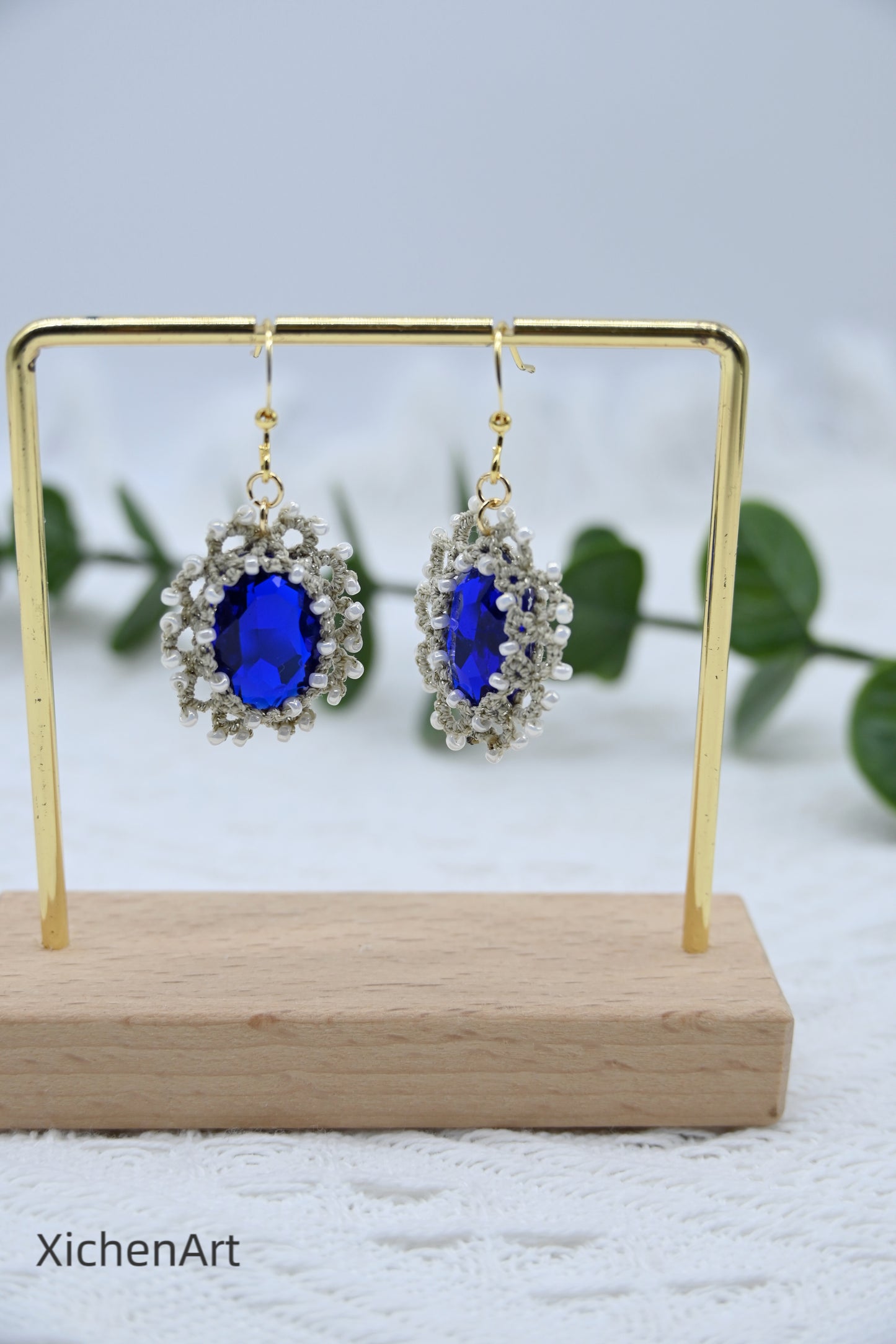 tatting earring with blue crystal