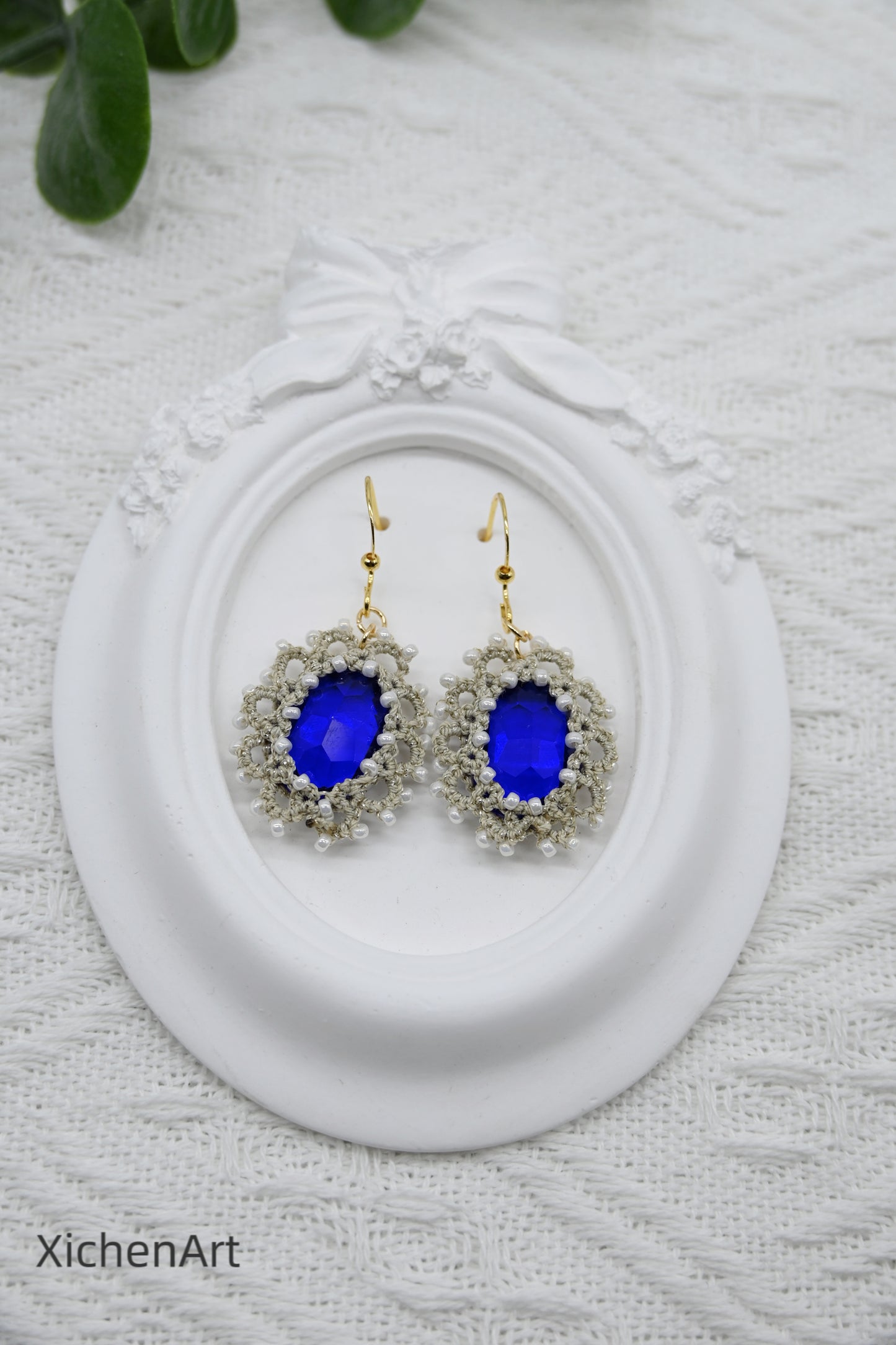 tatting earring with blue crystal